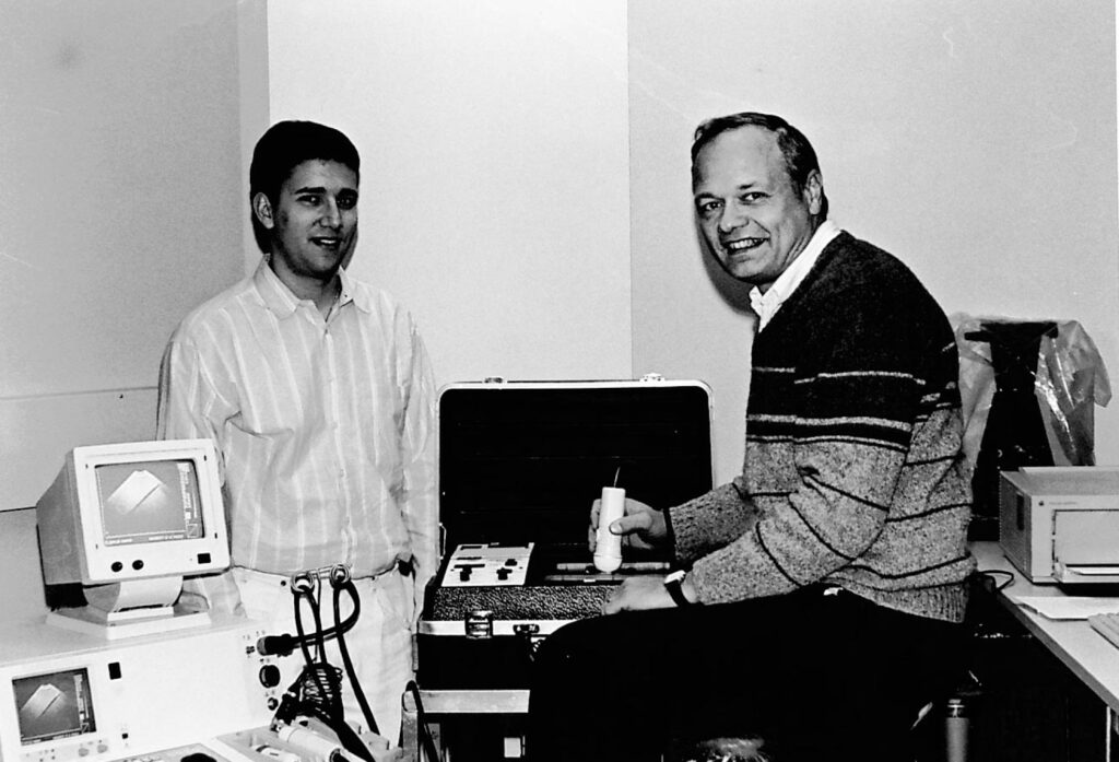 Jim Zagzebski and student stand in a lab